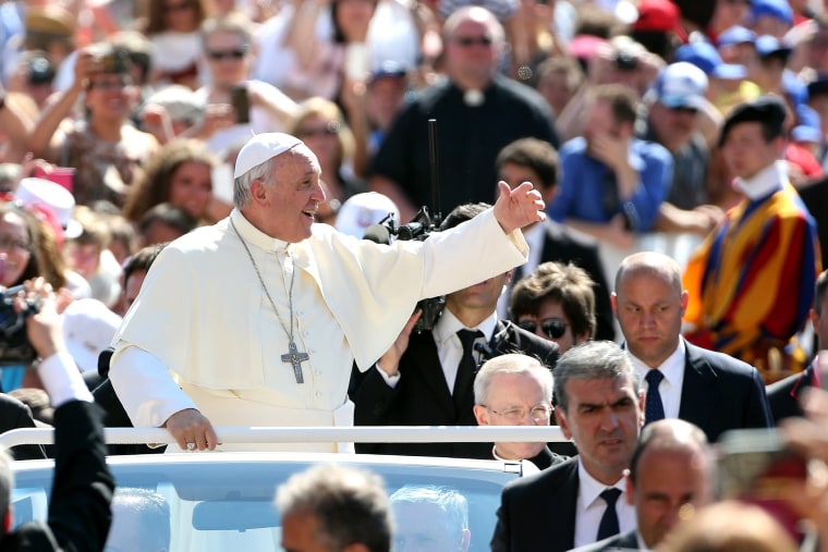 Pope Francis waves to the faithful as he arrives in St. Peter's square for his weekly audience on June 3, 2015 in Vatican City, Vatican. (Photo by Franco Origlia/Getty)