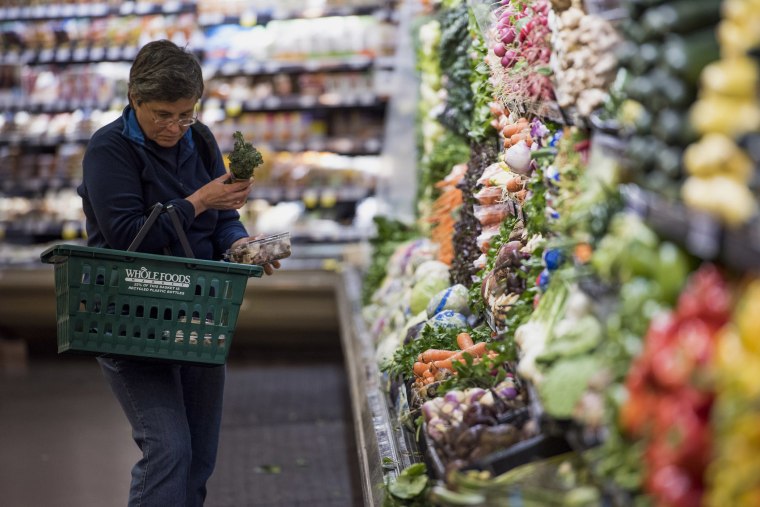 A customer shops for produce at a Whole Foods Market Inc. store in Oakland, Calif. on May 6, 2015.