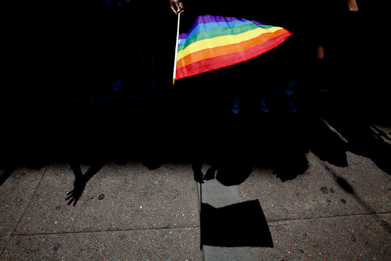 A parade goer waves a flag during 43rd annual San Francisco Lesbian, Gay, Bisexual, Transgender (LGBT) Pride Celebration & Parade June 30, 2013, in San Francisco, Calif. (Photo by Sarah Rice/Getty)