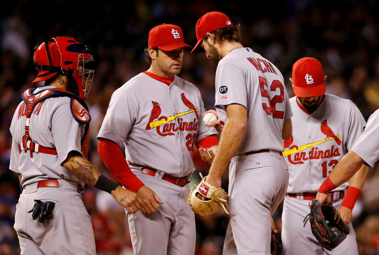 Manager Mike Matheny of the St. Louis Cardinals removes starting pitcher Michael Wacha from the game against the Colorado Rockies in the seventh inning, June 9, 2015 in Denver, Colo. (Photo by Doug Pensinger/Getty)