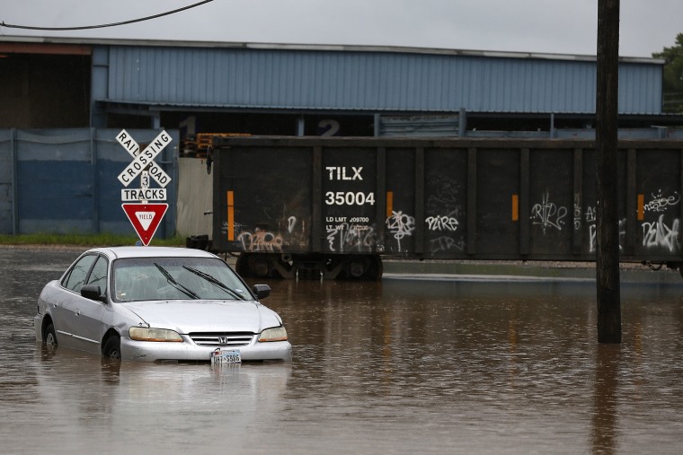 A vehicle is stranded in flood waters on Quitman Street as Tropical Storm Bill moves into the area in Houston, Texas, June 16, 2015. (Photo by Aaron M. Sprecher/EPA)