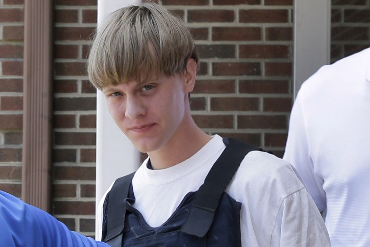 Charleston, S.C., shooting suspect Dylann Storm Roof is escorted from the Sheby Police Department in Shelby, N.C., June 18, 2015.