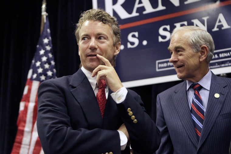 Rand Paul appears with his father U.S. Rep. Ron Paul during a campaign event in Erlanger, Ky. on Oct. 2, 2010. (Photo by Ed Reinke/AP)