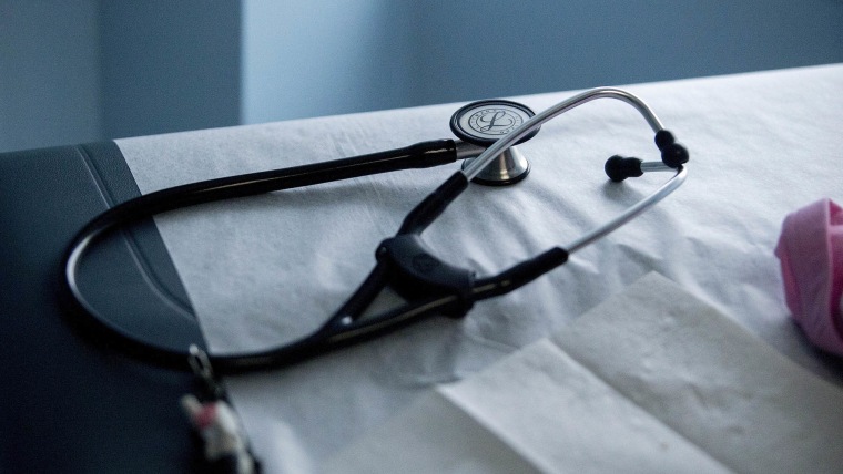 A stethoscope sits on an examination table in an exam room. (Photo by Andrew Harrer/Bloomberg/Getty)