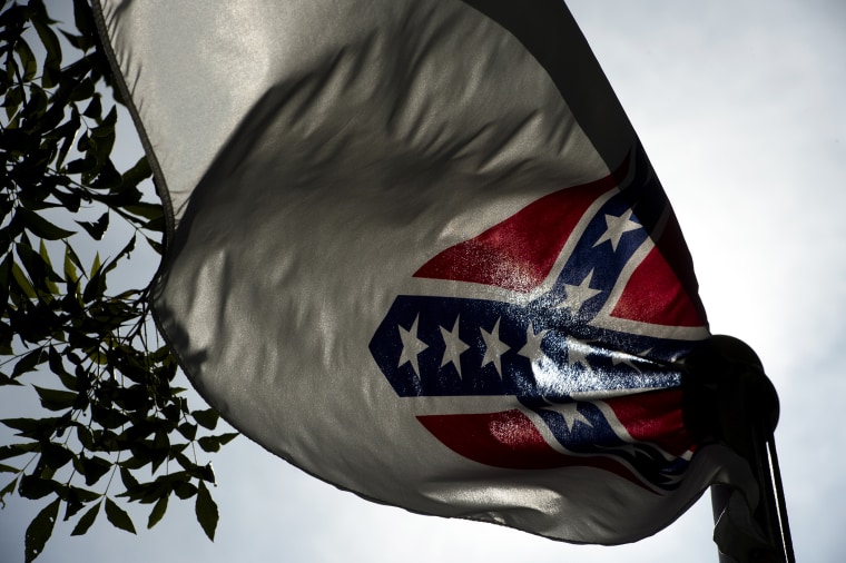 A Confederate flag flies next to the Alabama Confederate Memorial on the grounds of the Alabama Capitol building in Montgomery, Ala., June 22, 2015. (Photo by Albert Cesare/The Montgomery Advertiser/AP)