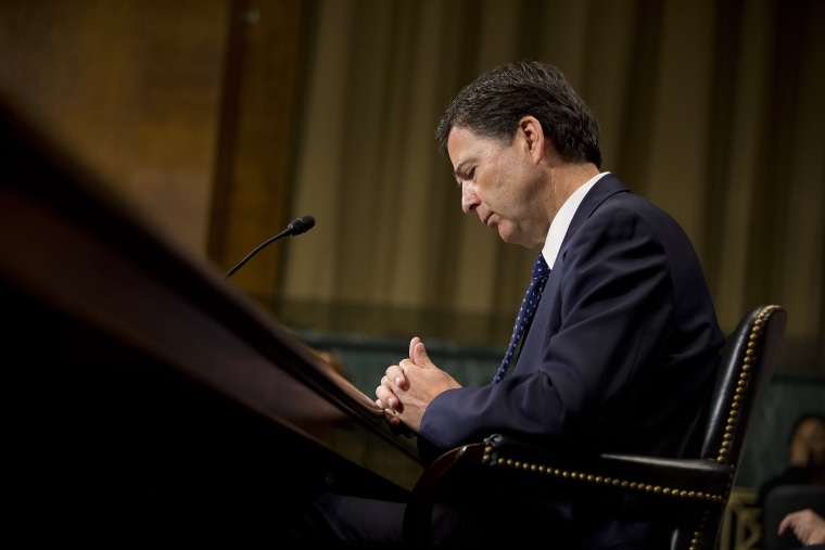 FBI Director then-nominee James Comey pauses as he testifies on Capitol Hill in Washington, July 9, 2013, before the Senate Judiciary Committee hearing on his nomination. (Photo by Evan Vucci/AP)