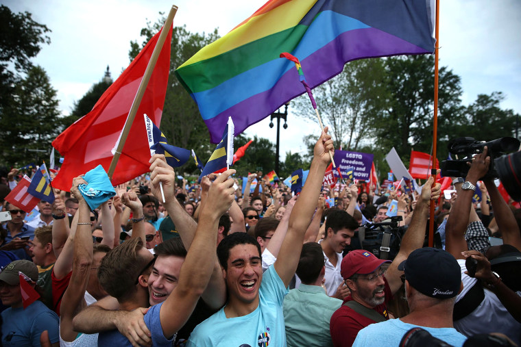 Same-sex marriage supporters rejoice after the U.S Supreme Court hands down a ruling regarding same-sex marriage June 26, 2015 outside the Supreme Court in Washington, D.C. (Photo by Alex Wong/Getty)