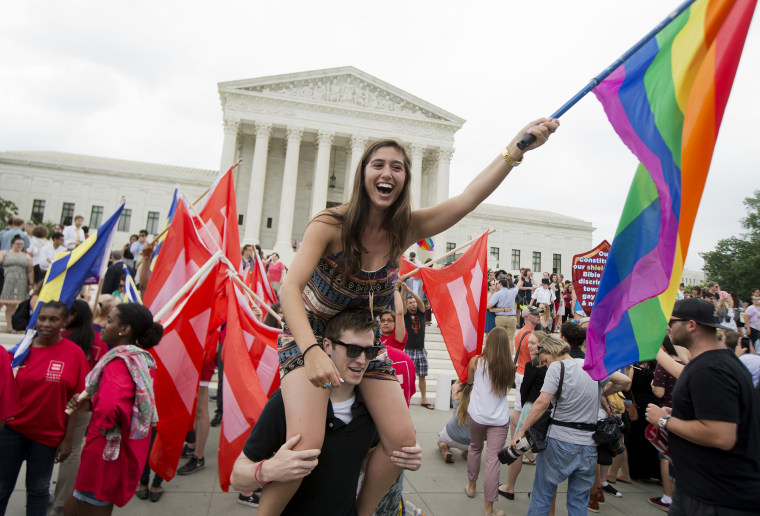 Sasha Altschuler of San Diego, Calif., joins the celebrations outside the Supreme Court in Washington, June 26, 2015 after the court declared that same-sex couples have a right to marry anywhere in the US. (Photo by Manuel Balce Ceneta/AP)
