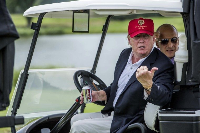 Donald Trump joins in the celebration of the opening of his championship golf course in Sterling, Va., June 23, 2015, (Photo by Jeffrey MacMillan/The Washington Post/Getty)