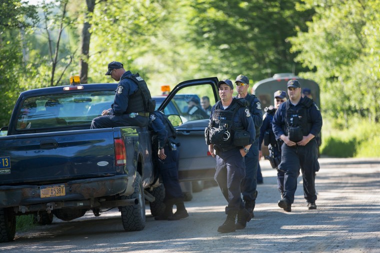 Law enforcement personnel prepare to head out on a search for convicted murderers Richard Matt and David Sweat on June 26, 2015 near Malone, N.Y. (Photo by Scott Olson/Getty)