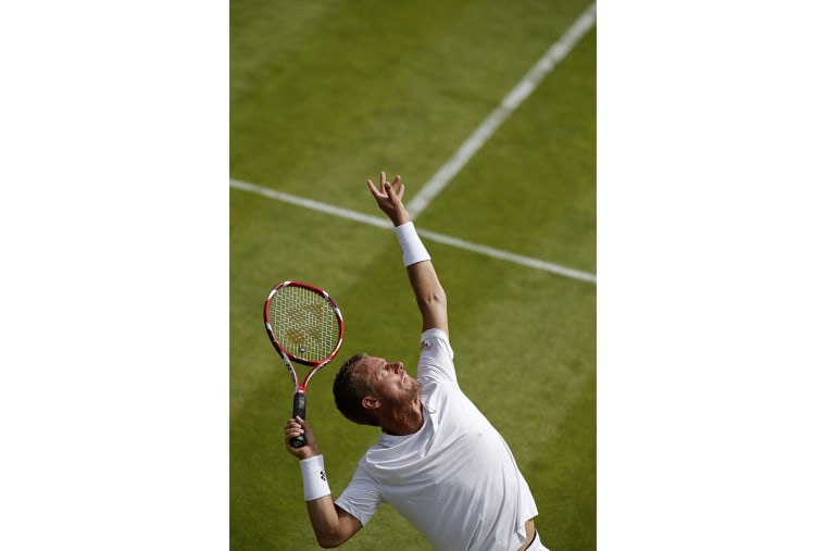 Australia's Lleyton Hewitt serves to Finland's Jarkko Nieminen during their men's singles first round match on day one of the 2015 Wimbledon Championships at The All England Tennis Club in Wimbledon, southwest London, on June 29, 2015.