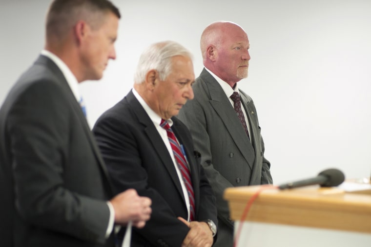 Suspended Clinton Correctional Facility corrections officer Gene Palmer, right, and attorney William J. Dreyer, center, appear in Plattsburgh Town Court as Palmer faces charges. (Photo by Ken Maldonado/New York Daily News/AP)