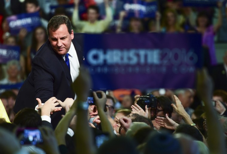 Chris Christie reaches out to greet a supporter after announcing that he will run for president at Livingston High School in Livingston, N.J., June 30, 2015. (Photo by Ron Antonelli/Bloomberg/Getty)