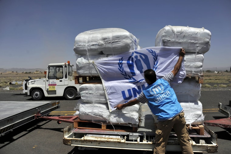 United Nations' workers carry humanitarian aid at Sanaa Airport, Yemen on May 16, 2015 (Photo by Mohammed Hamoud/Anadolu Agency/Getty).