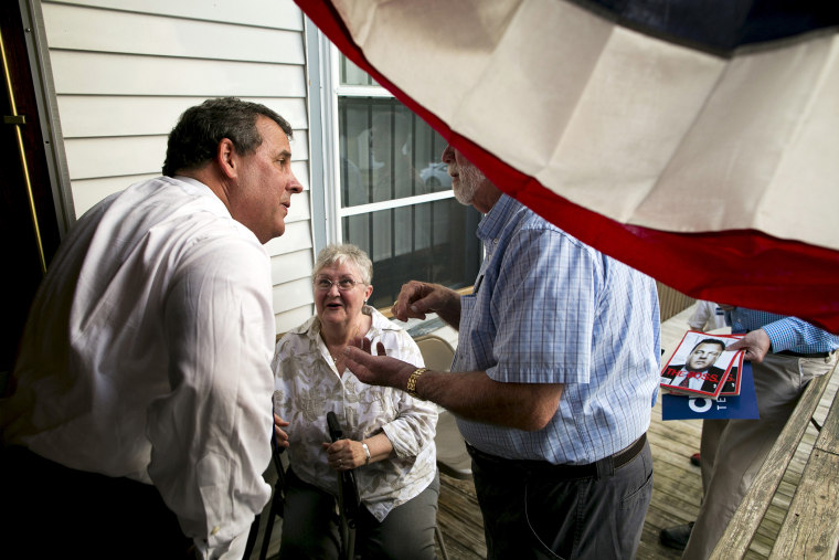 New Jersey governor and Republican presidential candidate Chris Christie speaks with supporters after a town hall event in Sandown