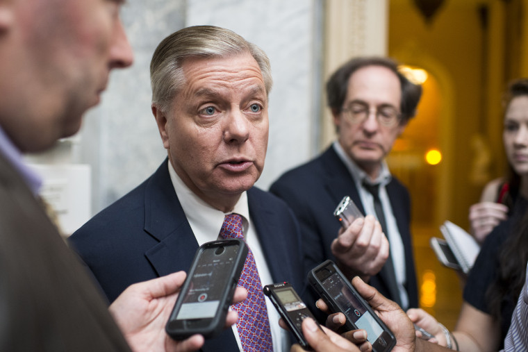 Sen. Lindsey Graham speaks with reporters as he leaves the Senate Republicans' policy lunch on June 16, 2015. (Photo by Bill Clark/CQ Roll Call/Getty)