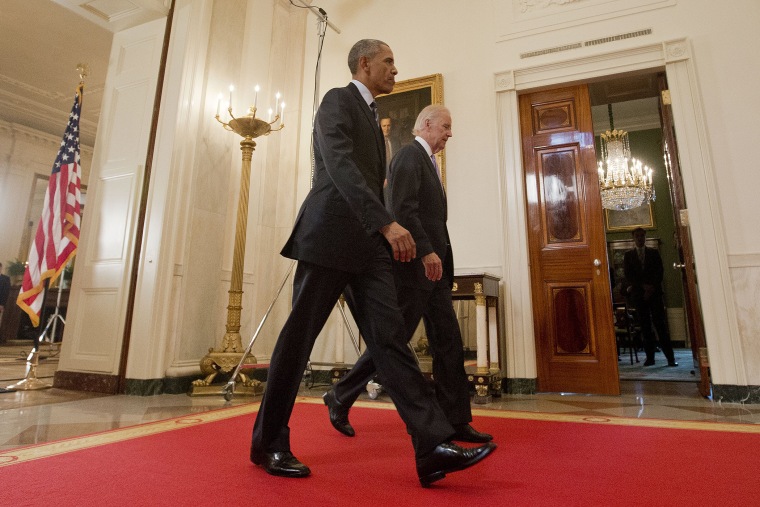President Barack Obama walks with Vice President Joe Biden, after delivering remarks in the East Room of the White House in Washington, D.C., July 14, 2015, after an Iran nuclear deal is reached. (Photo by Pablo Martinez Monsivais/AP)