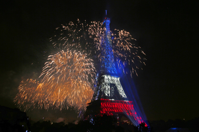 The Eiffel Tower is illuminated during the traditional Bastille Day fireworks display in Paris (Photo by Benoit Tessier/Reuters).