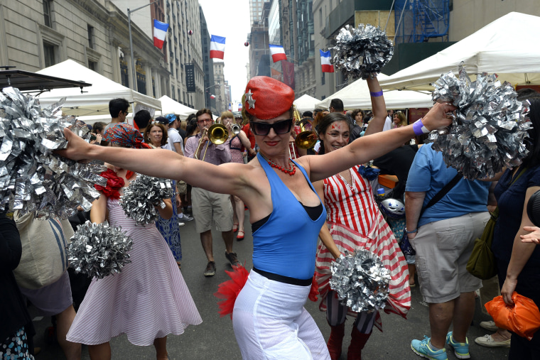 Members take part in the French Institute Alliance Francaise's street fair to celebrate Bastille Day in New York, N.Y. (Photo by Timothy A. Clary/AFP/Getty).