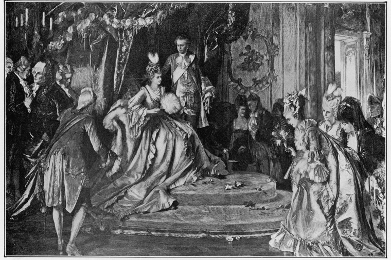 Marie-Antoinette married Louis XVI in 1770 and became Queen of France in 1774. Here, Marie-Antoinette and her husband, Louis (1754 - 1793), hold court in their apartments at Versailles (Photo by Hulton Archive/Getty).