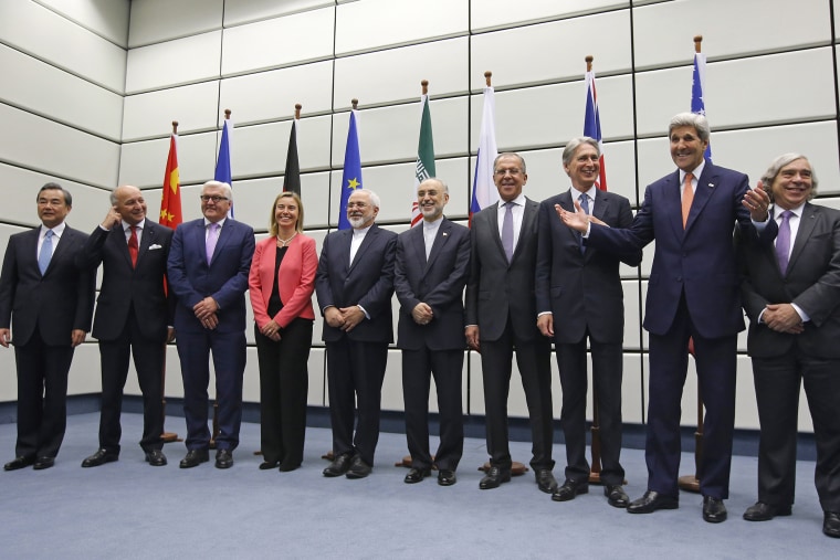 World powers pose for a group picture at the United Nations building in Vienna, Austria on July 14, 2015. (Photo by Carlos Barria/Pool/AP)