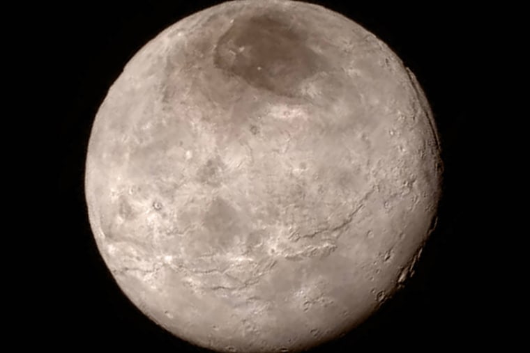 This image provided by NASA on Wednesday shows Pluto's largest moon, Charon, made by the New Horizons spacecraft (Photo by NASA/AP).