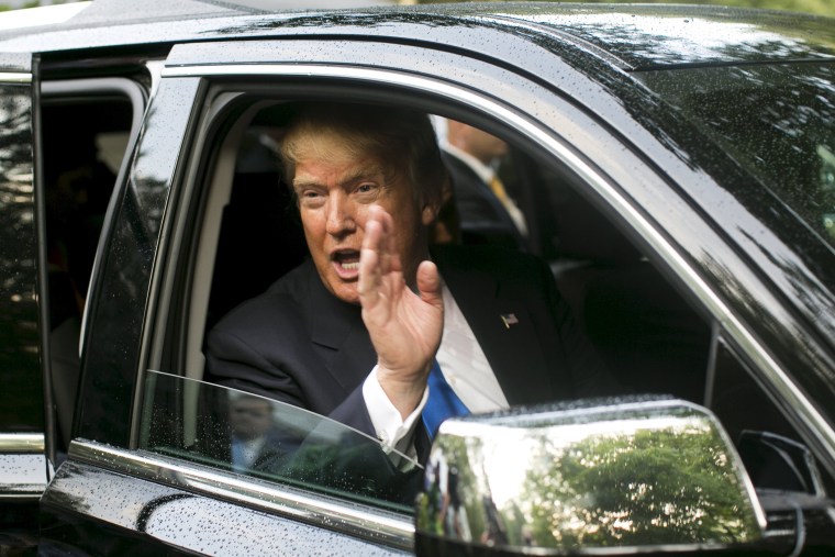 Businessman and Republican presidential candidate Donald Trump waves from his SUV after a back-yard reception in Bedford, New Hampshire, June 30, 2015. (Photo by Dominick Reuter/Reuters)