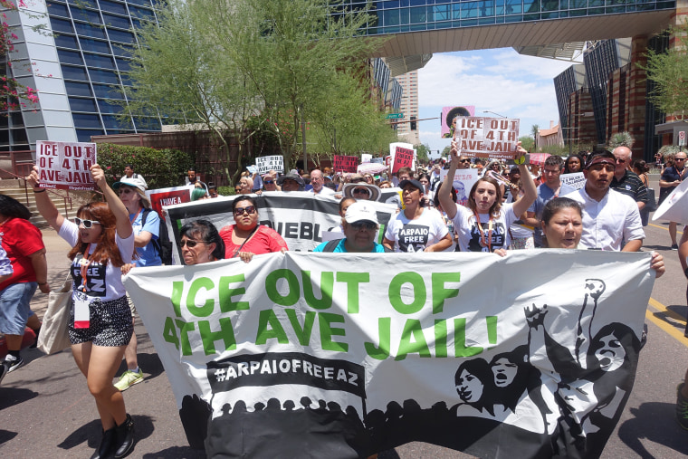 People attending the Netroots Nation march begin a half mile march in the heat behind a 'Ice out of 4th Ave jail!' banner to protest Sheriff Joe Arpaio's immigration policies on July 17, 2015. (Photo by Steve Rhodes/Demotix/Corbis)