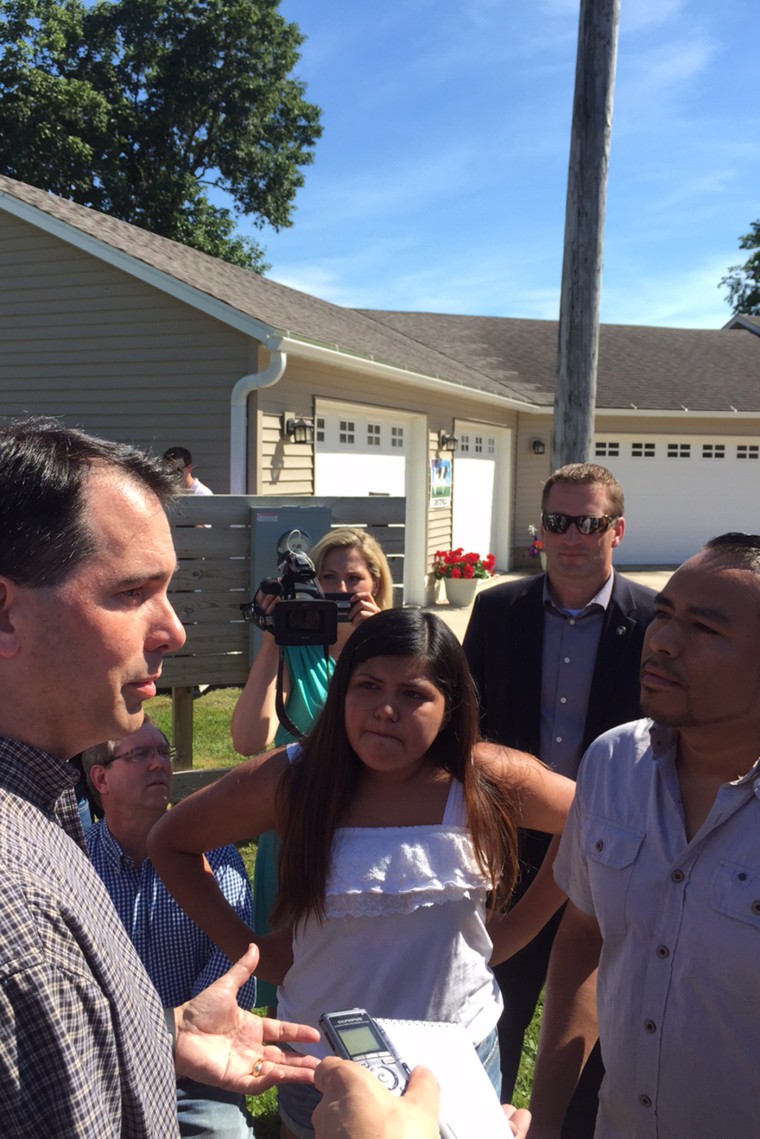 Jose Flores and his daughter Leslie Flores, 13, ask Wisconsin Governor Scott Walker to protect their family from deportation in Plainfield, Iowa on Jul. 19, 2015 (Photo by Benjamin Sarlin).