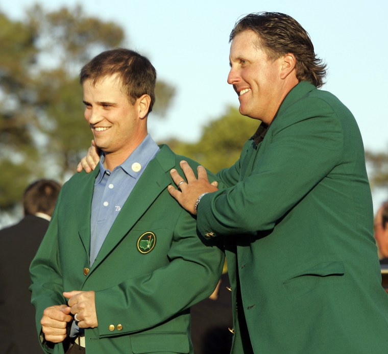 Zach Johnson, left, receives the Masters green jacket from last year's champion Phil Mickelson after winning the 2007 Masters golf tournament at the Augusta National Golf Club in Augusta, Ga. on April 8, 2007. (Photo by Morry Gash/AP)
