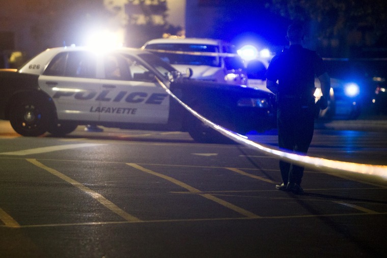 Police stand by at the scene outside the movie theatre where a man opened fire on film goers in Lafayette, La., July 23, 2015. (Photo by Lee Celano/Reuters)