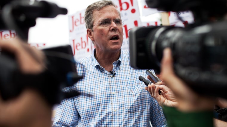 Republican Presidential candidate Jeb Bush speaks to the press at the 4th of July Parade in Merrimack, N.H. (Photo by Kayana Szymczak/Getty)