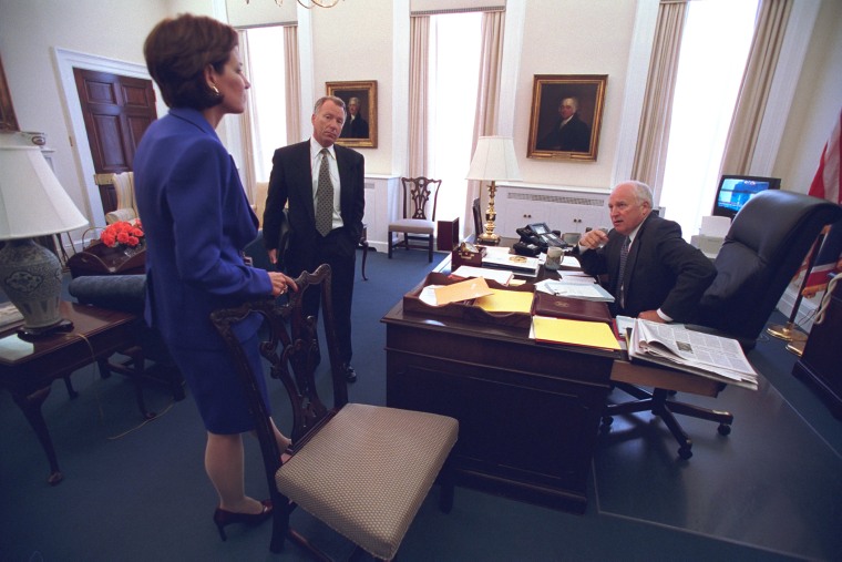 Vice President Cheney talks with advisers I. Lewis \"Scooter\" Libby and Mary Matalin in his office. Coverage of the attacks appears on the television at right. (Photo by David Bohrer/National Archives)