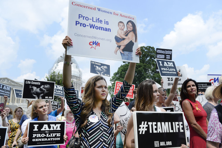 Anti-abortion activists hold a rally opposing federal funding for Planned Parenthood (Photo by Olivier Douliery/Getty).