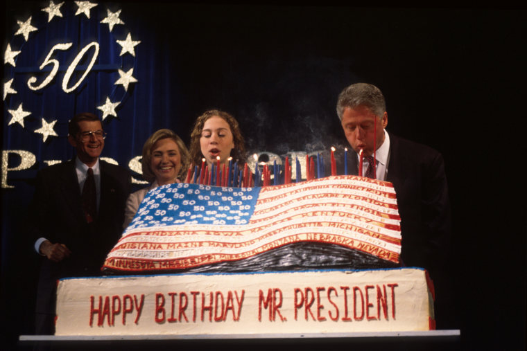 President Bill Clinton blows out candles Aug. 19, 1996 in New York, N.Y. (Photo by Dirck Halstead/Liaison/Getty)