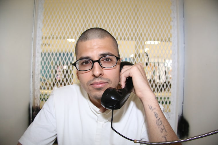 In this Aug. 5, 2015 photo, Daniel Lee Lopez, 27, speaks from a visiting cage outside death row at the Texas Department of Criminal Justice Polunsky Unit near Livingston, Texas. (Photo by Michael Graczyk/AP)