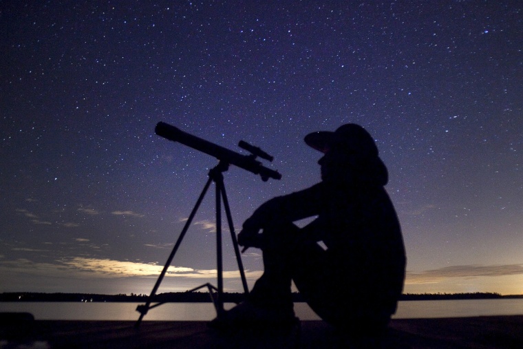 A stargazer waits for the Perseid meteor shower to begin near Bobcaygeon, Ontario, on Aug. 12, 2015. Picture taken August 12, 2015. (Photo by Fred Thornhill/Reuters)