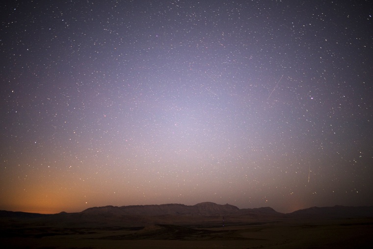 Meteor streaks across the sky in the early morning during the Perseid meteor shower in Ramon Carter near the town of Mitzpe Ramon, southern Israel, Aug. 13, 2015. (Photo by Amir Cohen/Reuters)