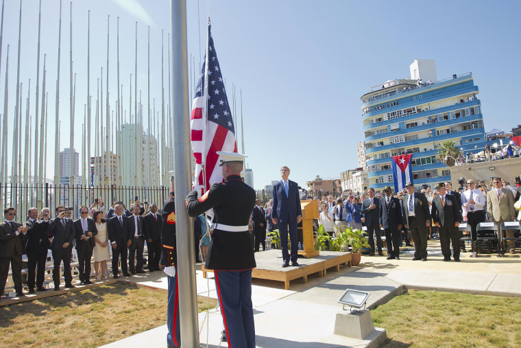 Secretary of State John Kerry, and other dignitaries watch as U.S. Marines raise the U.S. flag over the newly reopened embassy in Havana, Cuba, Aug. 14, 2015. (Photo by Pablo Martinez Monsivais/AP)