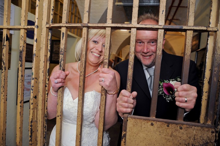 They say it's a life sentence, but Derek and Sandra Todd couldn't be happier than when they attached their ball and chain, literally, becoming the first to wed inside the Old Police Cells in Brighton, East Sussex, May 20, 2015. (Photo by Rex Features/AP)