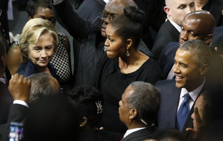 U.S. Democratic presidential candidate Hillary Clinton talks with first lady Michelle Obama and President Barack Obama after the conclusion of funeral services for Rev. Clementa Pinckney, Charleston, S.C., June 26, 2015. (Photo by Jonathan Ernst/Reuters)