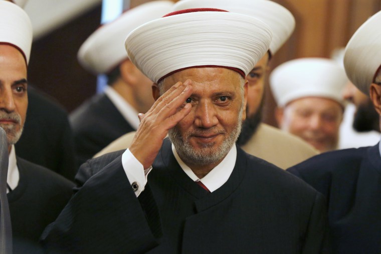 Newly appointed grand mufti Sheikh Abed el-Lateef Daryan gestures during a ceremony for his appointment in Beirut
