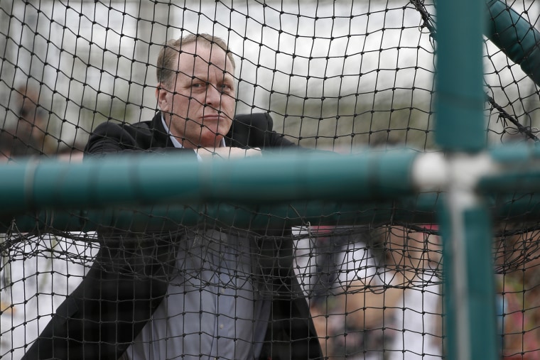 Baseball analyst and former Boston Red Sox pitcher Curt Schilling watches as infielders take batting practice at baseball spring training in Fort Myers Fla., Wednesday Feb. 25, 2015. (Photo by Tony Gutierrez/AP)