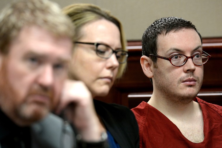 Defense attorneys Daniel King, left, and Katherine Spengler, sits at a table with James Holmes, right, as he appears in court for the sentencing phase of his trial Tuesday, Aug. 25, 2015. (Photo by RJ Sangosti/AP)