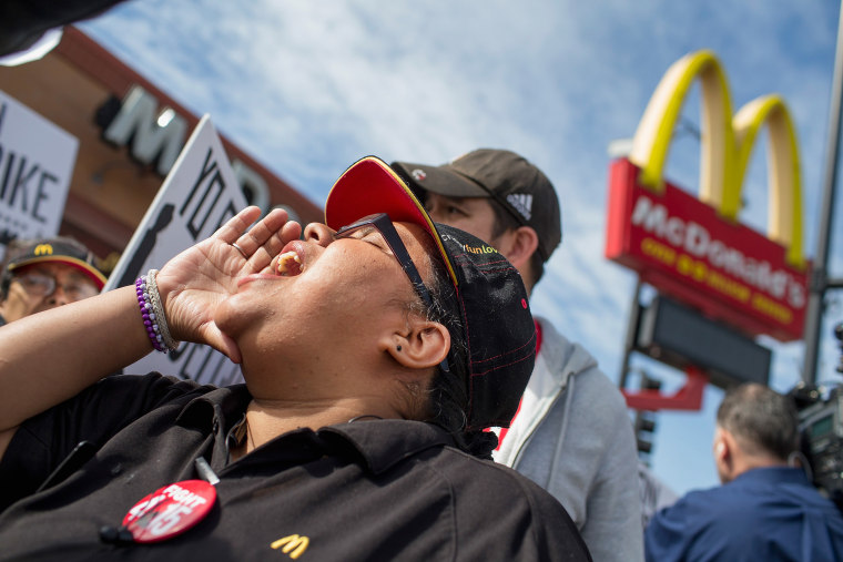 Demonstrators gather in front of a McDonald's restaurant to call for an increase in minimum wage on April 15, 2015 in Chicago, Illinois. (Photo by Scott Olson/Getty)