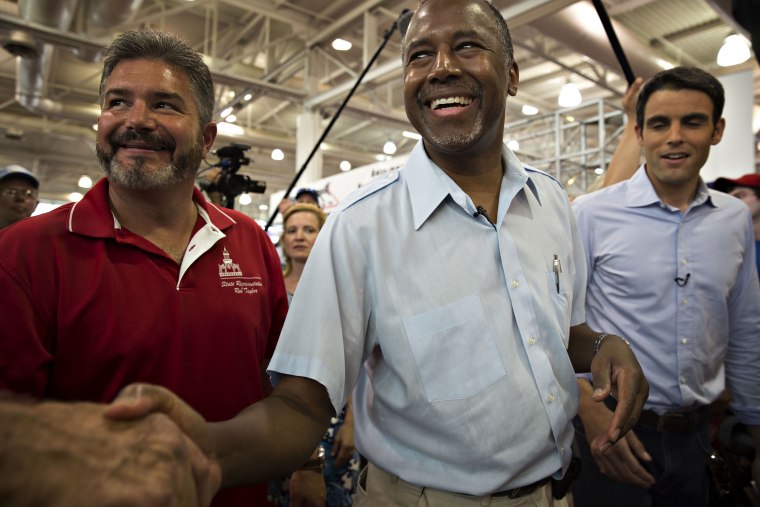 Ben Carson, 2016 Republican presidential candidate, greets attendees as he tours the Iowa State Fair in Des Moines, Ia., Aug. 16, 2015. (Photo by Daniel Acker/Bloomberg/Getty)