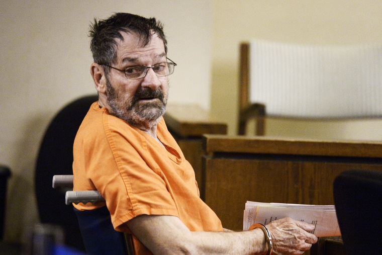 Frazier Glenn Cross, also known as Frazier Glenn Miller, sits with his defense team after being wheeled into a Johnson County courtroom for a scheduling session April 24, 2014, in Olathe, Kanas. (Photo by John Sleezer-Pool/Getty)