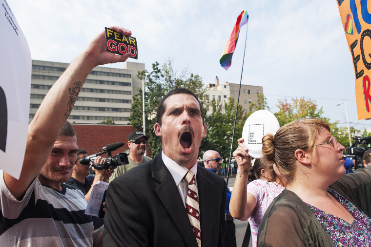 A protestor yells out against same-sex marriage supporters in front of the federal courthouse September 3, 2015 in Ashland, Kentucky. (Photo by Ty Wright/Getty)