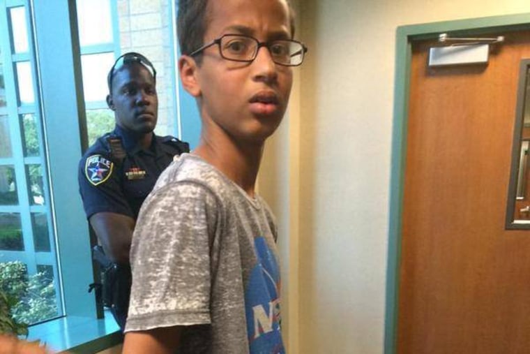 Ahmed Mohamed, A 14-year-old North Texas student, appears in handcuffs, after his arrest on charges of making a \"hoax bomb.\"