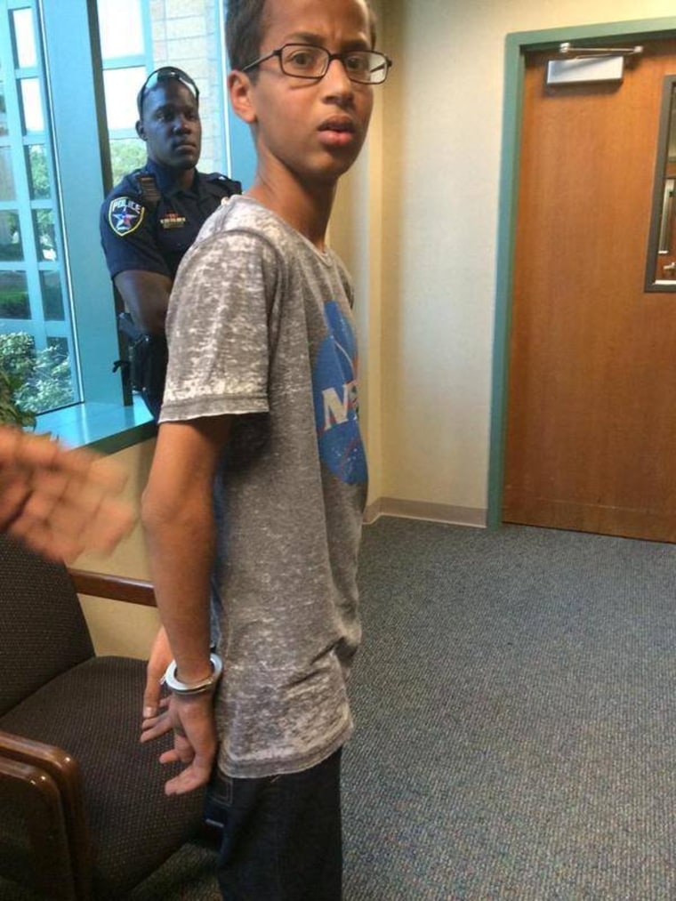 Ahmed Mohamed, A 14-year-old North Texas student, appears in handcuffs, after his arrest on charges of making a \"hoax bomb.\"